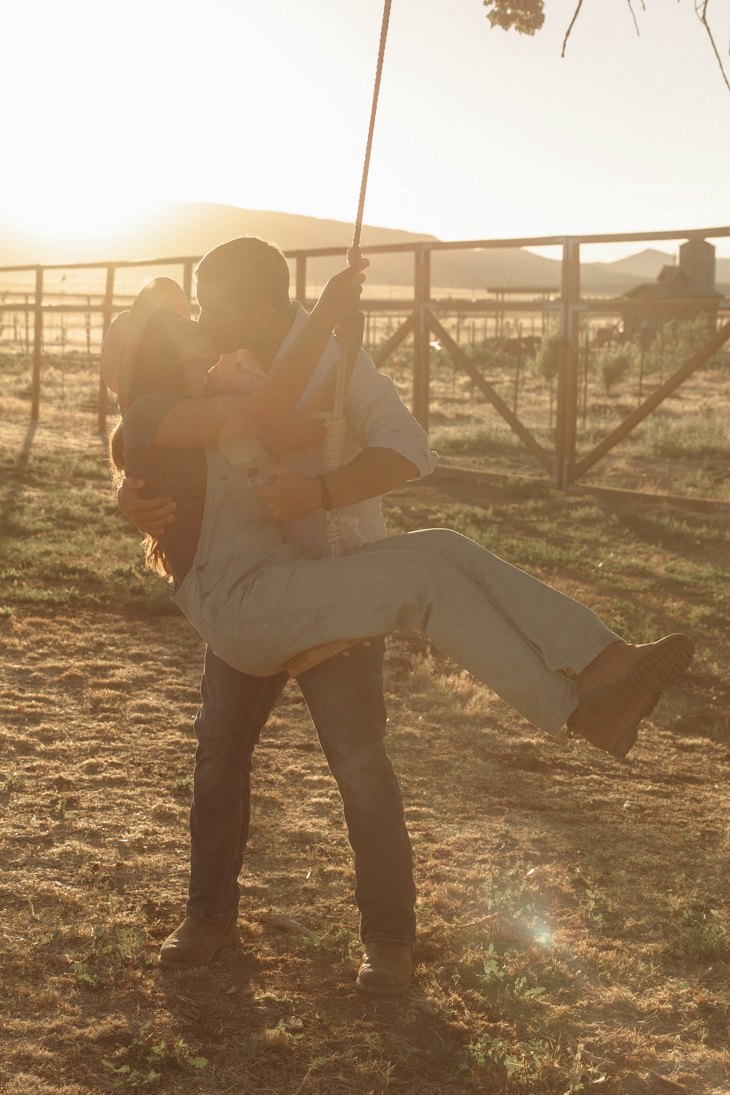 Couple Kissing on a swing at The Grand Ranch in Southern Utah Cedar City