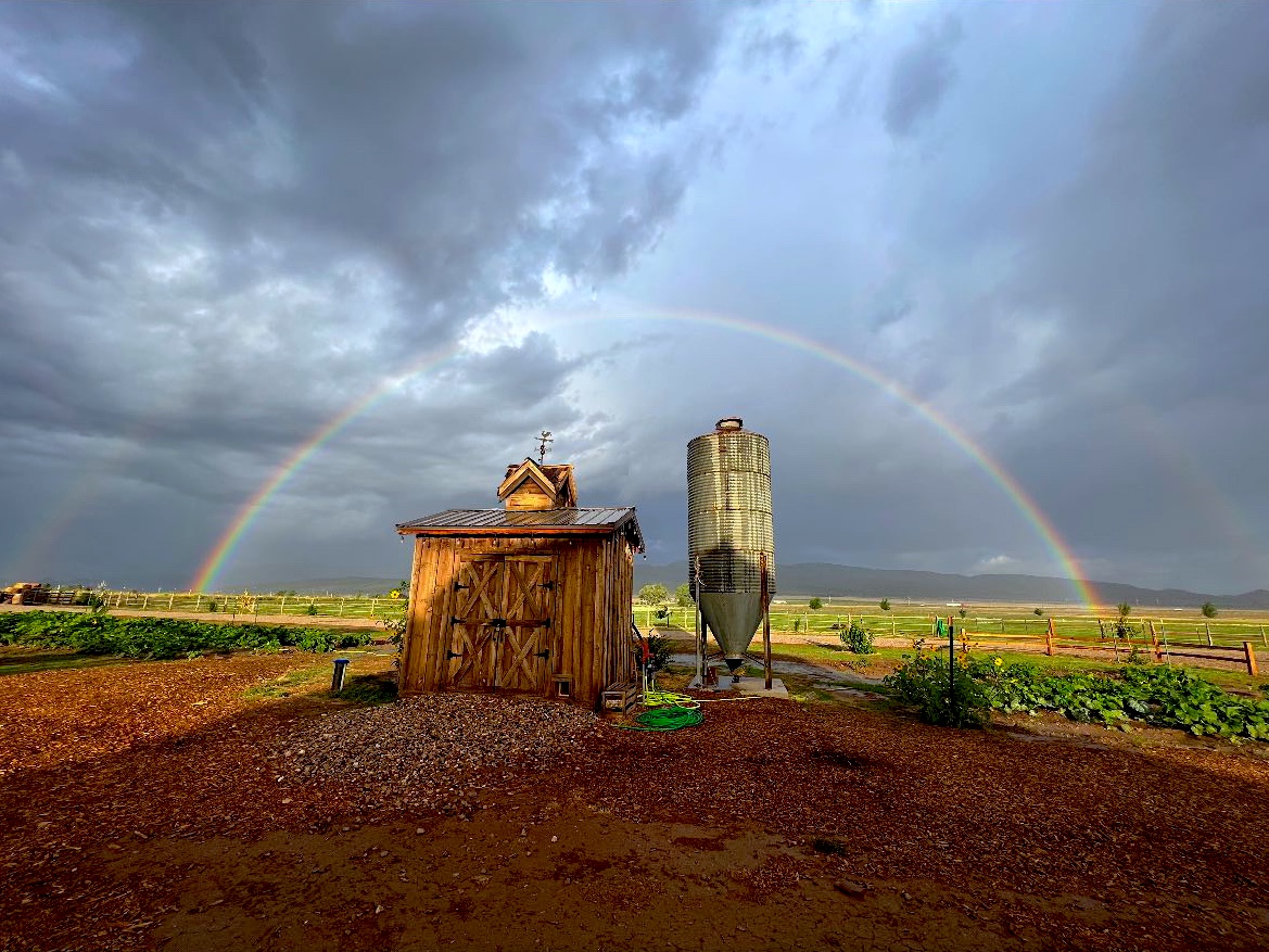 rainbow over a siloRent the ranch, the grand ranch, farmstay in utah